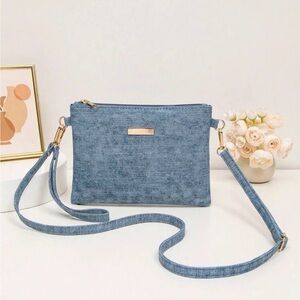 Blue Crossbody Bag with Denim Texture and Gold Accent
